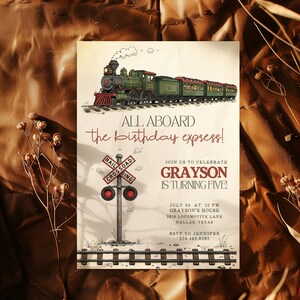 May include: An invitation with a vintage train illustration. The text reads "All Aboard the birthday express!" and "Grayson is turning five!" Includes a railroad crossing sign and the date, time, and location of the party.