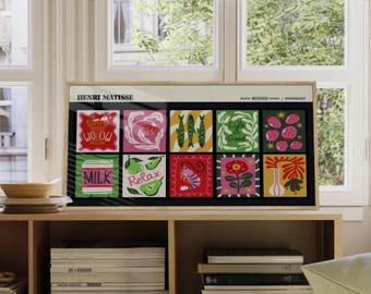 May include: A framed print with a colorful, abstract design. The print features a grid of nine squares, each with a different image. The images include a can of milk, a shrimp, a pear, a bowl of fruit, and a fish. The print is titled "Henri Matisse" and is framed in a natural wood frame.