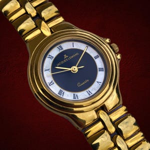 Jacques Lemans nr. 642 in 10mic verguld quartz dames damespolshorloge met parelmoer wijzerplaat Zwitserse makelij 3atm pure luxe elegantie