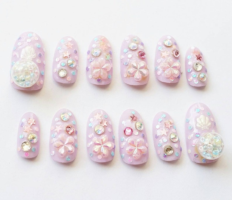 4D nails, Japanese nail art, lilac, sakura, fake nails, beads nail art, glass dome jewelry, oval nails, festive nails, Christmas nail art image 2