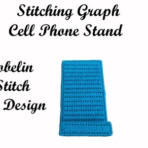 May include: A blue plastic canvas phone stand, stitched with a gobelin stitch. The stand is designed to hold a cell phone upright.