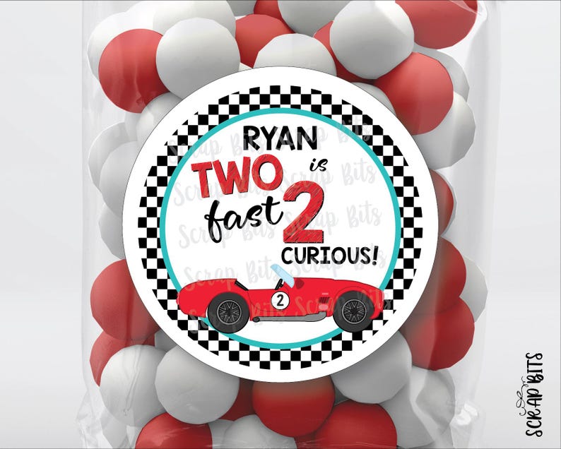 May include: A round sticker with a checkered black and white background. The sticker has a red race car with the number 2 on it. The text on the sticker reads "Ryan is Two fast 2 curious!"
