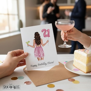 A birthday card with a woman holding a pink balloon and a glass of pink cocktail, celebrating her 21st birthday.