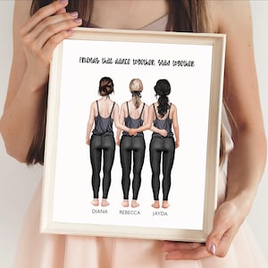 May include: A framed print featuring an illustration of three individuals standing side-by-side with arms linked. They wear grey tank tops and black leggings. The text reads: Friends that dance together, stay together. Names Diana, Rebecca, and Jayda appear below.