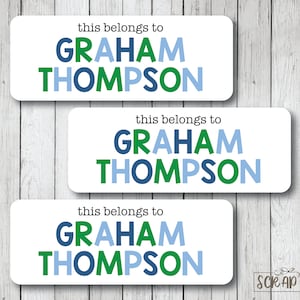May include: Three white labels with blue and green text that reads "this belongs to GRAHAM THOMPSON".