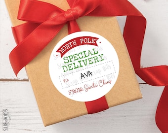 May include: A round white gift tag sticker featuring a red banner with the text NORTH POLE, green text reading SPECIAL DELIVERY, and a dashed box containing the name AVA. The tag includes the red text TO: and FROM: Santa Claus.