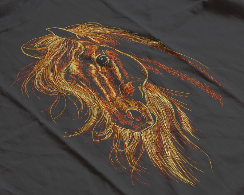 May include: An embroidered horse head design in shades of gold, orange, and brown. The horse's mane and facial features are intricately detailed against a dark gray background. The artwork captures the horse's profile with flowing lines.