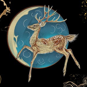 May include: A golden deer with large antlers is depicted in a leaping pose against a circular blue moon background. The design features intricate line work and white spots on the deer's body, set against a black background with gold accents.