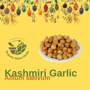 May include: A white plate filled with Kashmiri garlic cloves, also known as Allium sativum. The garlic cloves are a light brown color and have a slightly wrinkled texture. The plate is on a yellow background with a logo that says "A symbol of trust, Organic Spice Herbs".