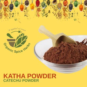May include: A glass bowl containing Katha powder, a reddish-brown spice, with a wooden scoop. The image includes the text "Katha Powder Catechu Powder" and a logo for "Organic Spice Herbs."