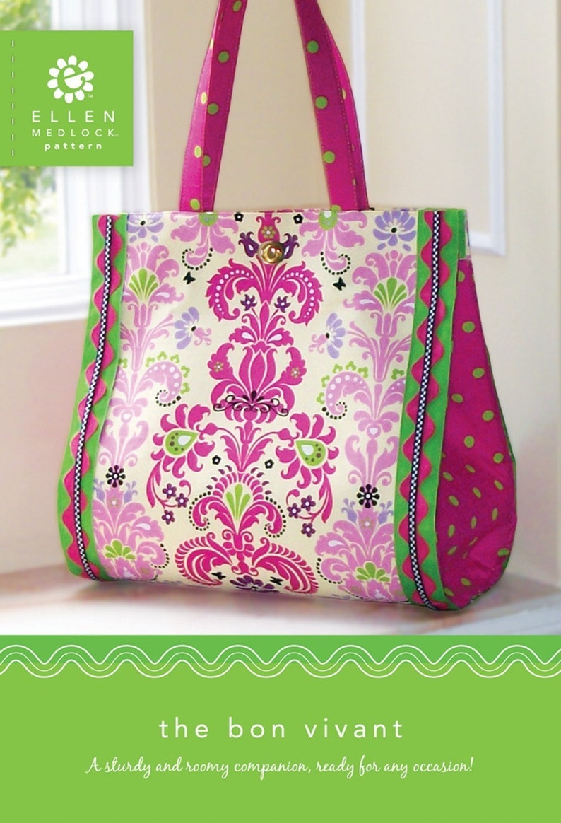 Pode incluir: Uma bolsa tote rosa e verde com um padr&atilde;o floral e detalhes de bolinhas. A bolsa tem um design robusto e &eacute; etiquetada como "the bon vivant".