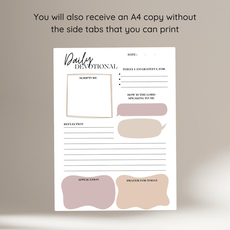 May include: A white Daily Devotional journal with a minimalist design. The journal includes sections for scripture, reflection, and prayer. The text "Daily Devotional" is at the top, with prompts like "Today I am grateful for" and "How is the Lord speaking to me."