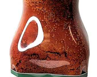 May include: A 1-liter bottle of red palm oil labeled "Torborgee Oil" from Legacy Foods. The bottle has a red cap and a green label with the company logo and the words "Premium Quality".