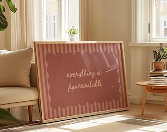 May include: A framed art print with the phrase "everything is figureoutable" in a handwritten style. The artwork features a pink scalloped border and vertical stripes, set in a light wood frame. The print is leaning against a beige sofa.