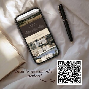 May include: A smartphone displays a website with a landscape image and text. A black pen rests beside the phone on a white surface. A QR code and the text "Scan to view on other devices!" are also visible.