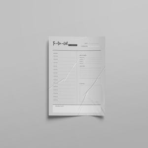 Könnte beinhalten: Ein weißes To-Do-Listen-Planerblatt aus Papier mit schwarzem Text und Linien. Die Kopfzeile lautet To-Do-List Planner mit Feldern für Datum und Flüssigkeitszufuhr. Es enthält einen Tagesplan von 6:00 bis 22:00 Uhr, einen Essensplan und Tagesziele.
