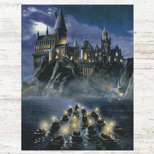 May include: A nighttime illustration of Hogwarts School of Witchcraft and Wizardry, a large stone castle with many towers and windows, set on a rocky cliff overlooking a dark, misty lake.  A line of small boats with lights are traveling towards the castle.