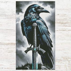 May include: A detailed illustration of a raven perched atop a sword. The raven is depicted with dark blue and black feathers, and the sword has an ornate handle and blade. The background features a cloudy sky.
