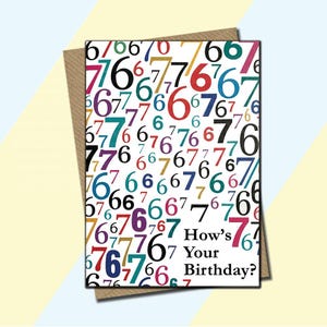 May include: A birthday greeting card with a white background covered in colorful numbers. The card has the text "How's Your Birthday?" and is set in a brown envelope.