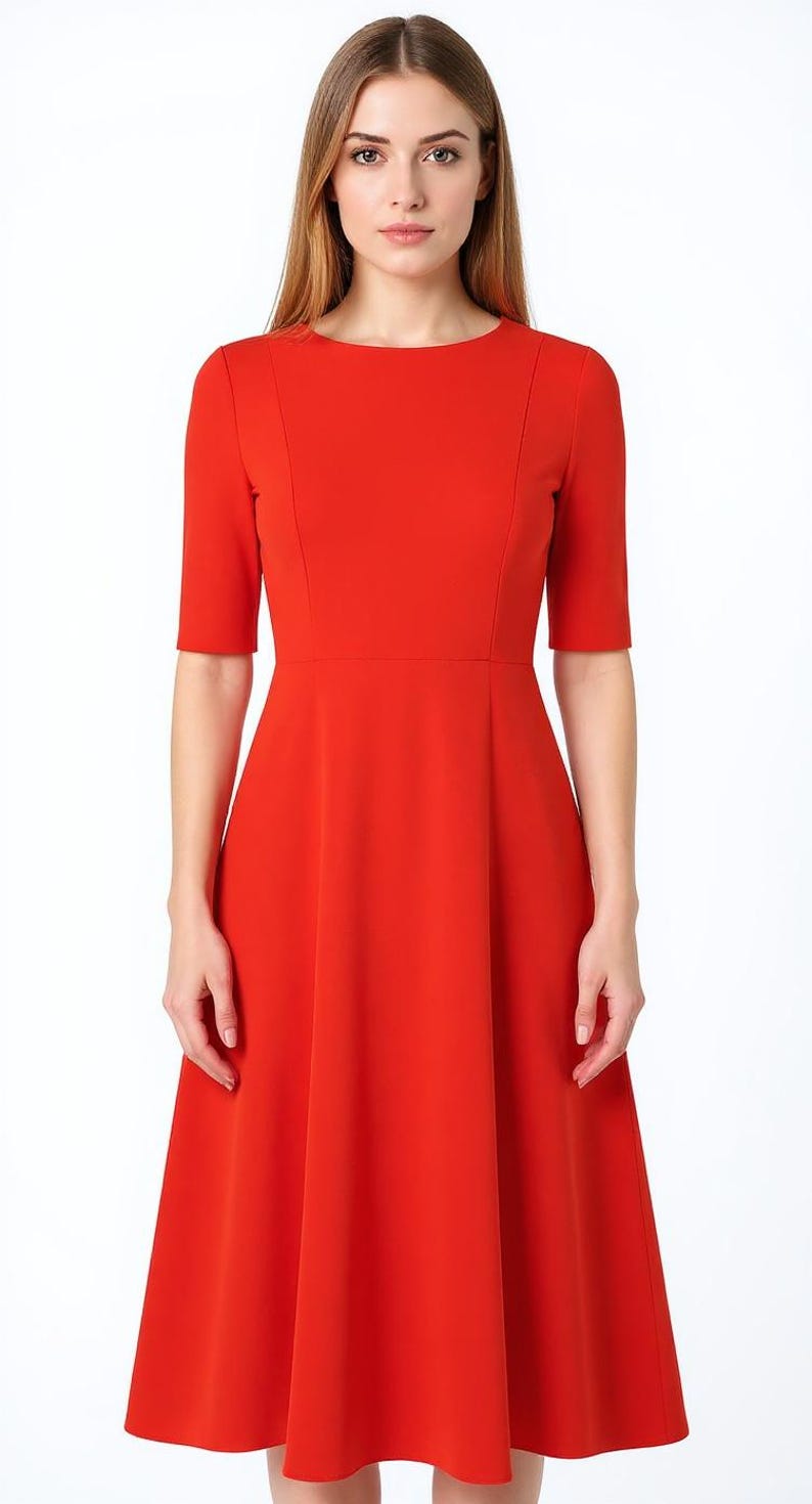 May include: A vibrant red midi dress featuring a round neckline, elbow-length sleeves, and a fitted bodice that transitions into a flared, A-line skirt. The garment is constructed with vertical seam detailing along the front torso and waist.