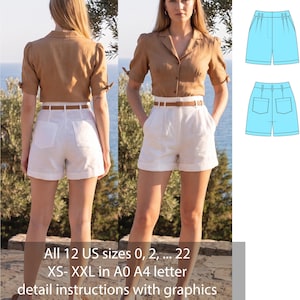 Puede incluir: Una camisa de manga corta color canela con botones, cuello y detalles de lazo en las mangas, combinada con pantalones cortos blancos de cintura alta con un cinturón marrón fino y bolsillos traseros. Incluye un dibujo técnico del pantalón y el texto: All 12 US sizes 0, 2, ... 22 XS- XXL in A0 A4 letter detail instructions with graphics.