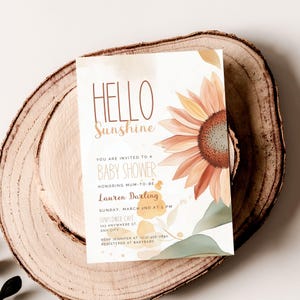 May include: A baby shower invitation with a sunflower illustration. The text reads "Hello Sunshine" and includes details about the event, including the date, time, and location. RSVP information is also included.