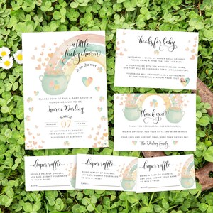 May include: A baby shower invitation with a rainbow, pot of gold, and shamrocks. The invitation says "A little lucky charm is on the way" and includes the name "Lauren Darling". There are also cards for a diaper raffle and a request for books for the baby.