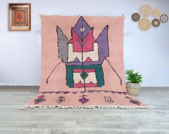 Moroccan wool Beni Ourain rug in soft pink with bold abstract tribal pattern, authentic hand-knotted Berber carpet for living room decor