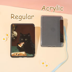 May include: A black tablet case with a cat eating pizza, labeled "Regular", next to a clear acrylic case. The cat image is on a dark background. The word "Acrylic" is above the clear case.