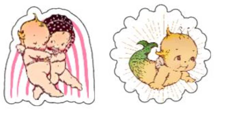 May include: Two vintage-style baby dolls, one with a pink and white striped background and the other with a yellow background and a sunburst design. The doll with the striped background is holding the other doll. Both dolls have blonde hair and blue eyes.