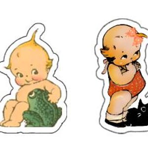 May include: Two vintage-style illustrations of children. The first shows a blonde baby with a green frog. The second shows a baby with a red dress and a black cat.