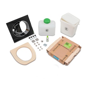May include: A complete kit for building a composting toilet. The kit includes a black toilet seat, a wooden toilet seat, a white plastic bucket, a white plastic tank, a bottle of glue, and a package of hardware. The package is labelled "buildyourbackyard.com".
