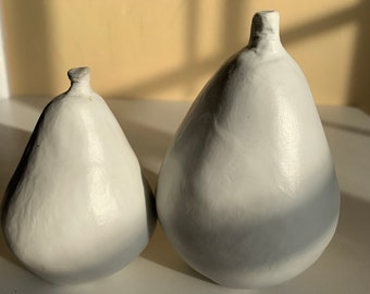 small and large porcelain pears