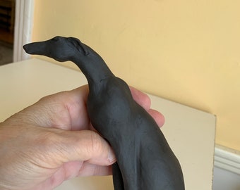 sleek black greyhound, whippet, sighthound dog sculpture