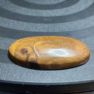 May include: A set of three ceramic mugs with a speckled, matte finish. The mugs are in shades of cream, light gray, and dark gray. Each mug has a simple, minimalist design, perfect for coffee or tea.