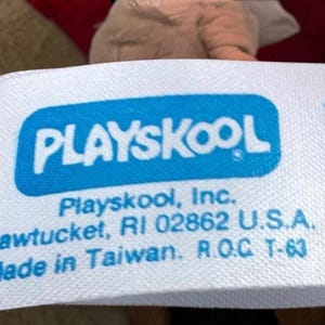 a close-up of a blue and white label with text, likely related to a product or company.