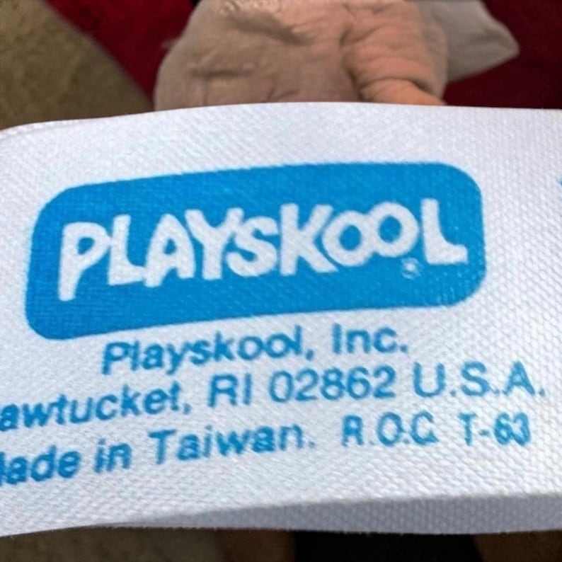 a close-up of a blue and white label with text, likely related to a product or company.