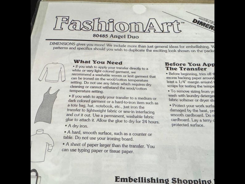 The image is a page from a fashion art book, featuring various fashion items such as dresses and shirts, along with instructions on how to transfer patterns onto fabric.