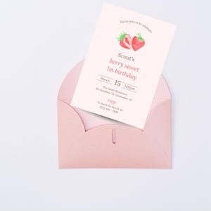 May include: Pink invitation with a strawberry graphic for Scout's 1st birthday party. The invitation includes the date, time, and location of the party. RSVP information is also included.
