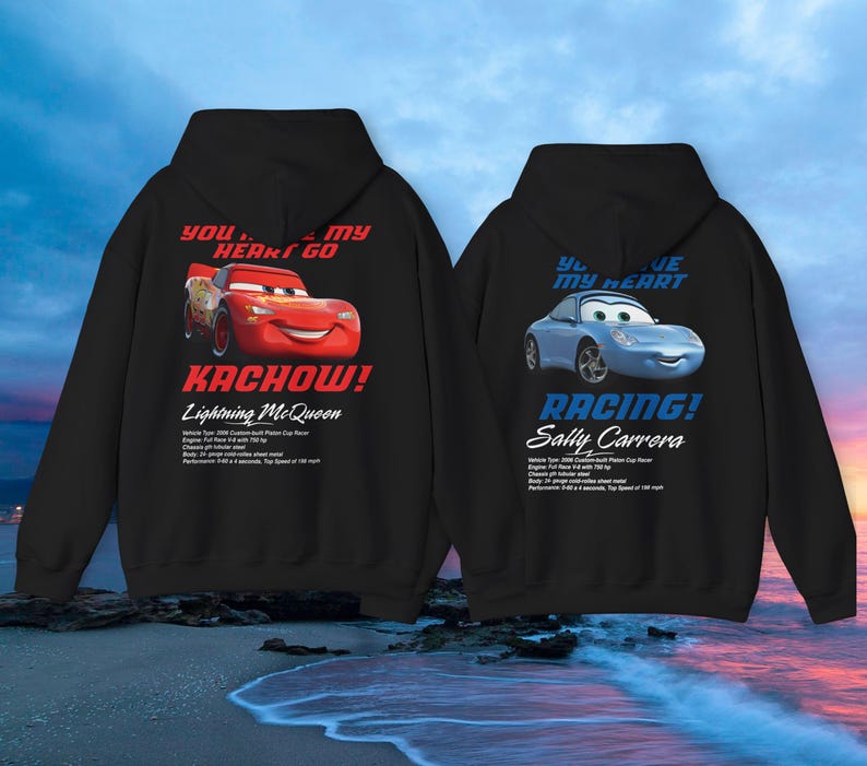 May include: Two black hoodies with Cars movie graphics. One features Lightning McQueen with "Kachow!" and "You stole my heart go" text. The other displays Sally Carrera with "Racing!" and "You stole my heart" text.