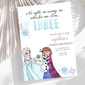 May include: A birthday invitation with a Frozen theme, featuring Elsa, Anna, and Olaf. The design includes the word "THREE" in blue, with text stating "No right, no wrong, no rules for me. I'm..." and party details. The invitation has a watercolor style.