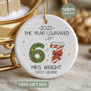 May include: White ceramic Christmas ornament with gold string, featuring text "-2025- THE YEAR I SURVIVED" and "67" with a Christmas tree and candy cane design. The ornament also includes "MRS. WRIGHT FIRST GRADE".