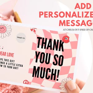 May include: A pink and white card with the words "THANK YOU SO MUCH!" in large black letters. The card has a checkered pattern and decorative smiley faces and flowers. The text "ADD A PERSONALIZED MESSAGE!" is at the top.