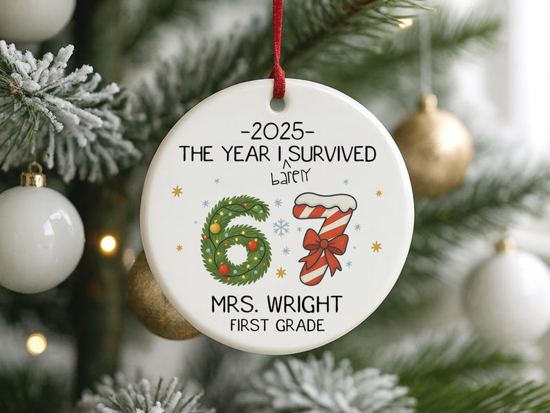 May include: A white ceramic Christmas ornament with a red ribbon. The ornament features the text "-2025- THE YEAR I SURVIVED barely" and "67" in a wreath design, a candy cane, and "MRS. WRIGHT FIRST GRADE".