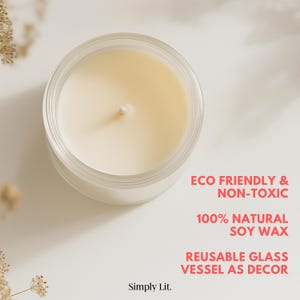May include: A top-down view of a candle in a clear glass jar. The candle has a creamy white wax and a central wick. Text on the right reads: "ECO FRIENDLY & NON-TOXIC", "100% NATURAL SOY WAX", and "REUSABLE GLASS VESSEL AS DECOR".