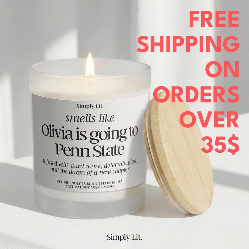 May include: A lit candle in a frosted glass jar with a wooden lid. The label reads "smells like Olivia is going to Penn State." Text on the label also says "infused with hard work, determination, and the dawn of a new chapter." The candle is eco-friendly and made with natural soy wax.