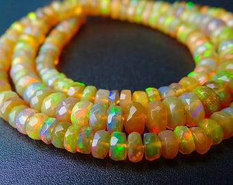 7 inches...Finest golden Yellow Ethiopian opal faceted rondelle beads....4-5mm