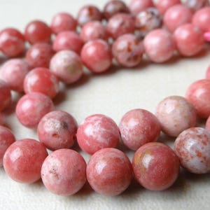 Genuine pink Thulite smooth round beads.. 7.5 Inches...8mm