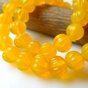Glowing Yellow quartz carved pumpkin beads