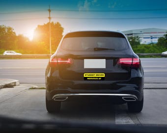May include: A black car with a yellow sticker that reads "Student Driver Nervous AF" on the back bumper.